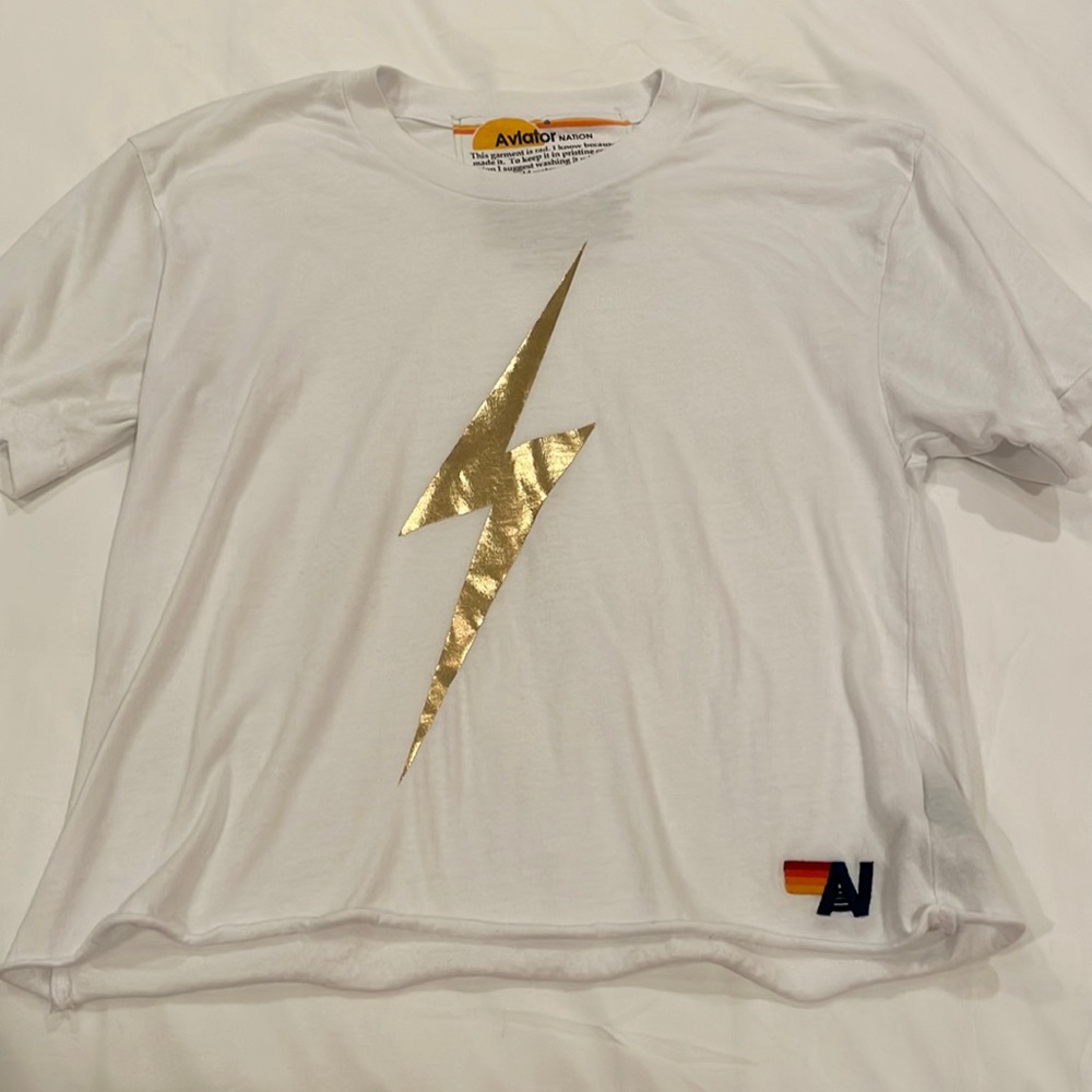 white and gold lightning bolt tee aviator nation